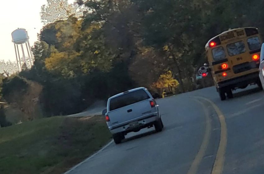 A driver who passed a loaded Neshoba County school bus stopped on a highway dropping off children was cited by the county sheriff after photos of the incident appeared on Facebook Tuesday afternoon.